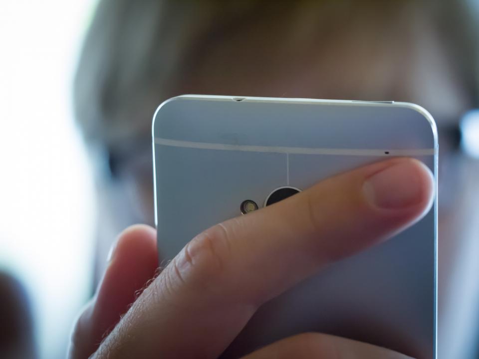 Business owner reviewing missed website leads on a smartphone