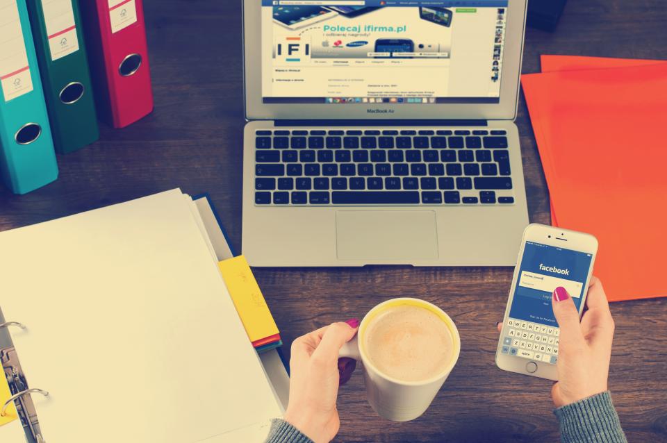 Online appointment booking on a business website at an office desk